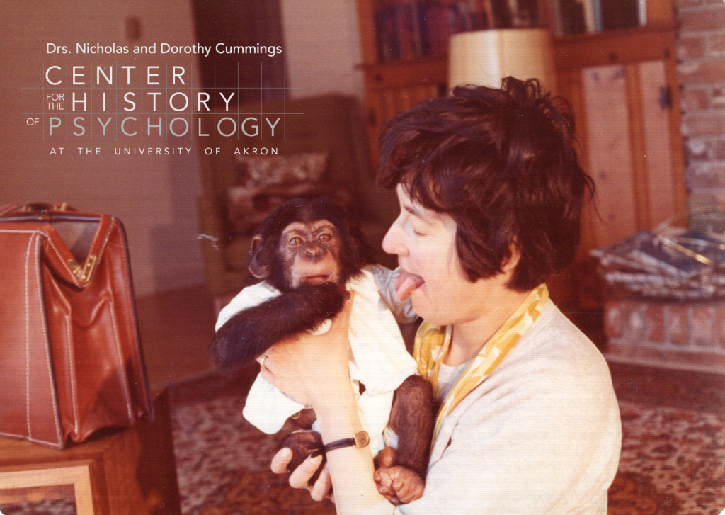 A digitized photograph of a woman holding an infant chimpanzee to her chest. The woman is looking at chimp with her tongue sticking out.  The chimp is looking at the camera and has a hand to her mouth.